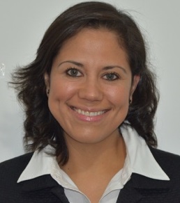 a woman with medium length brown hair, smiling